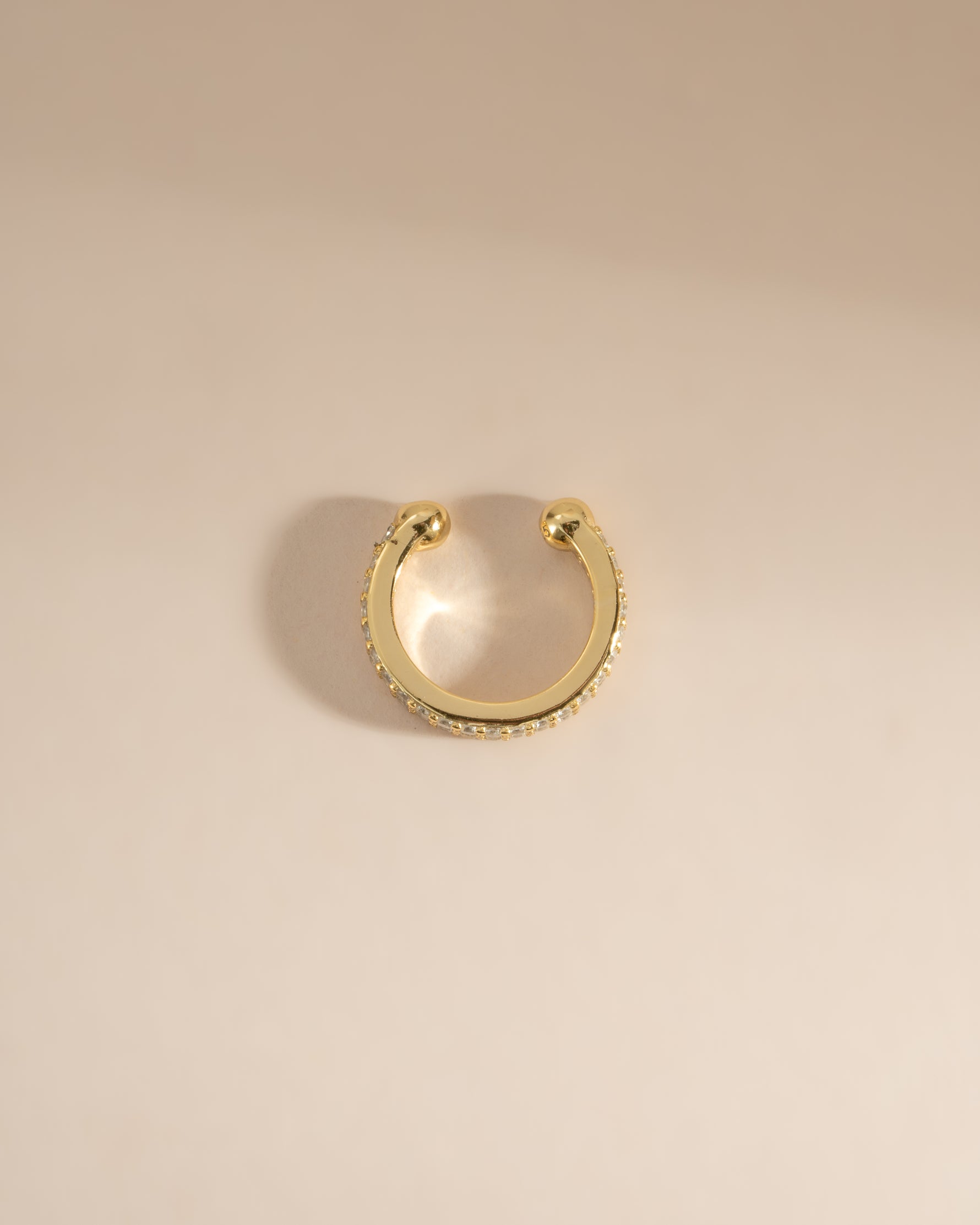 Gold double-row CZ ear cuff earrings by Sami Jewels, top view showing sparkling diamond-like stones and stylish design.