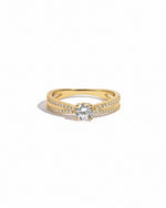 double shank diamond ring in gold on a white background