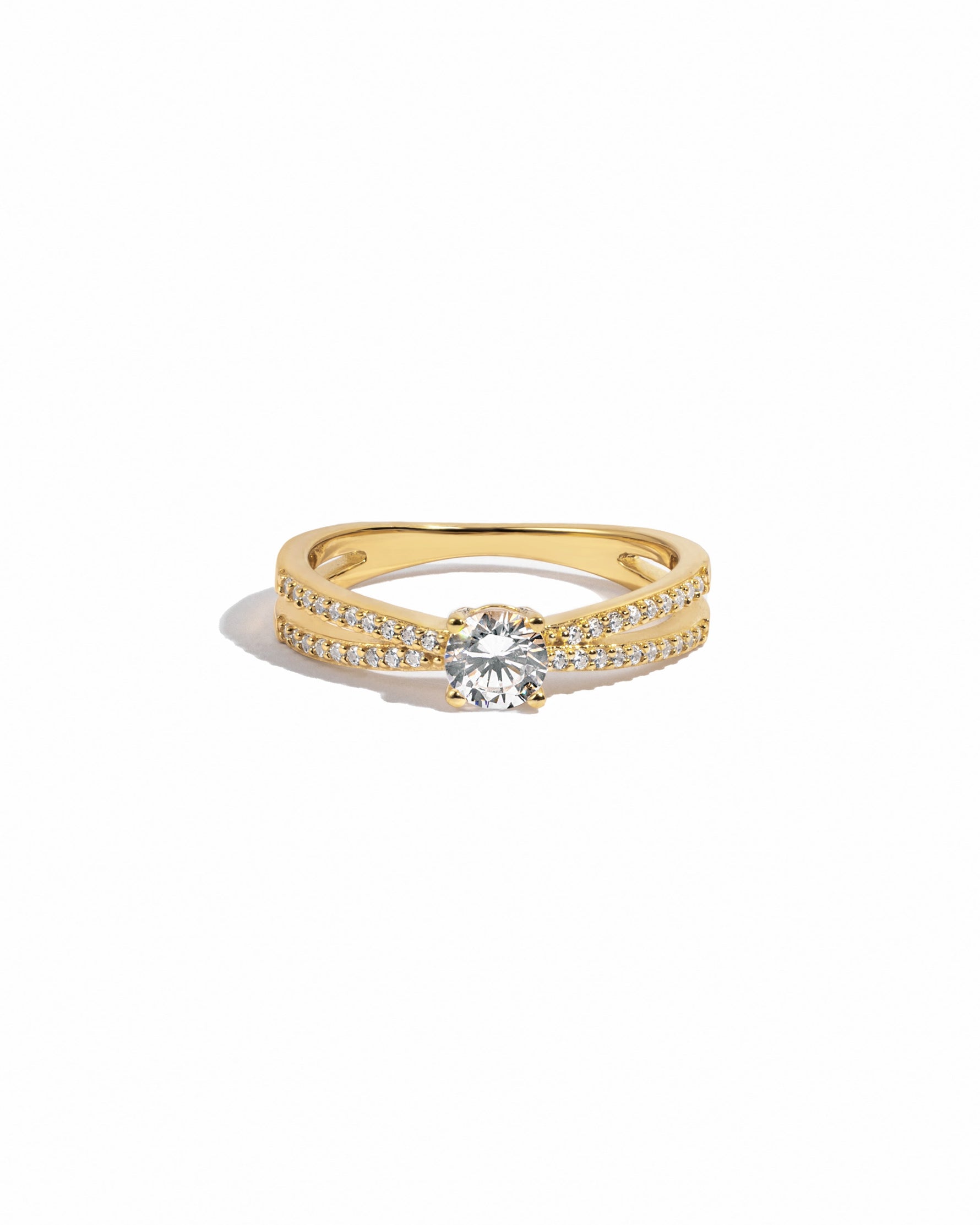 double shank diamond ring in gold on a white background