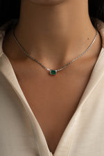 Emerald baguette bezel statement necklace by Sami Jewels featuring sterling silver setting and vibrant green emerald stones.