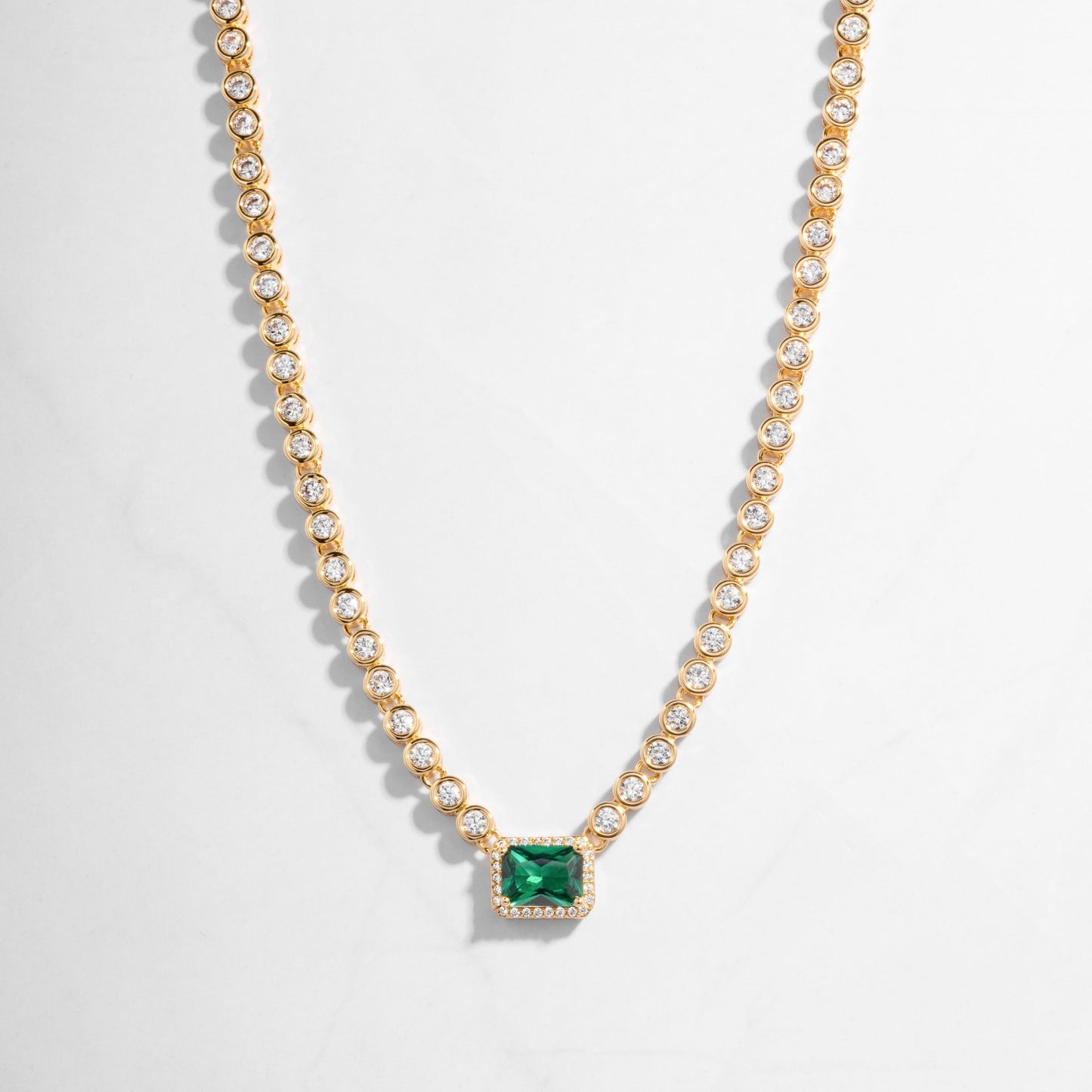 Emerald Tennis Necklace in gold, with emerald pendant surrounded by tiny diamonds. Gift for her from Sami Jewels