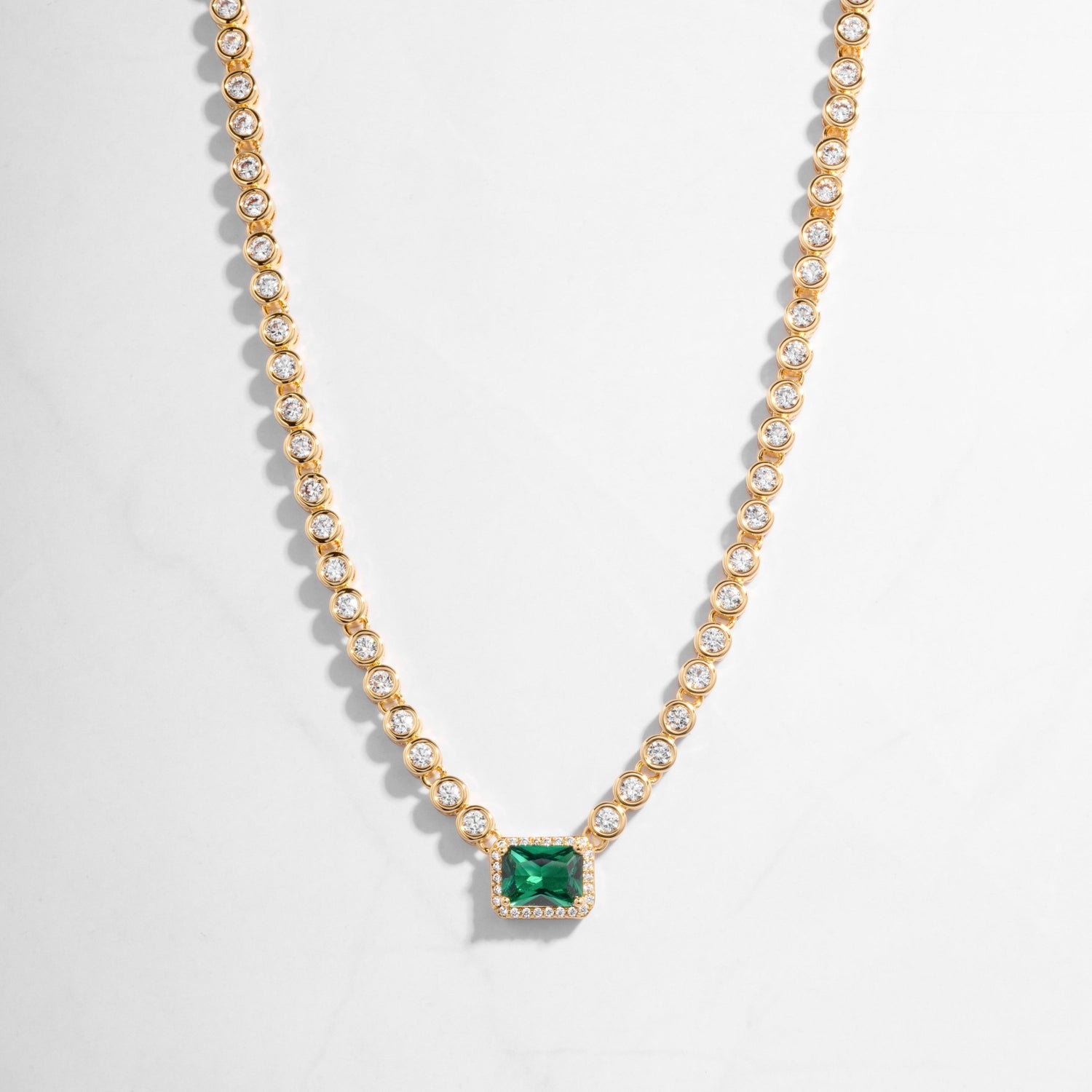 Emerald Tennis Necklace in gold, with emerald pendant surrounded by tiny diamonds. Gift for her from Sami Jewels