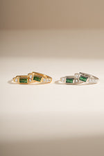 Emerald baguette huggie earrings by Sami Jewels featuring gold and sterling silver with sparkling emerald stones.