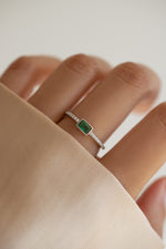 emerald baguette ring with pave band in sterling silver on model