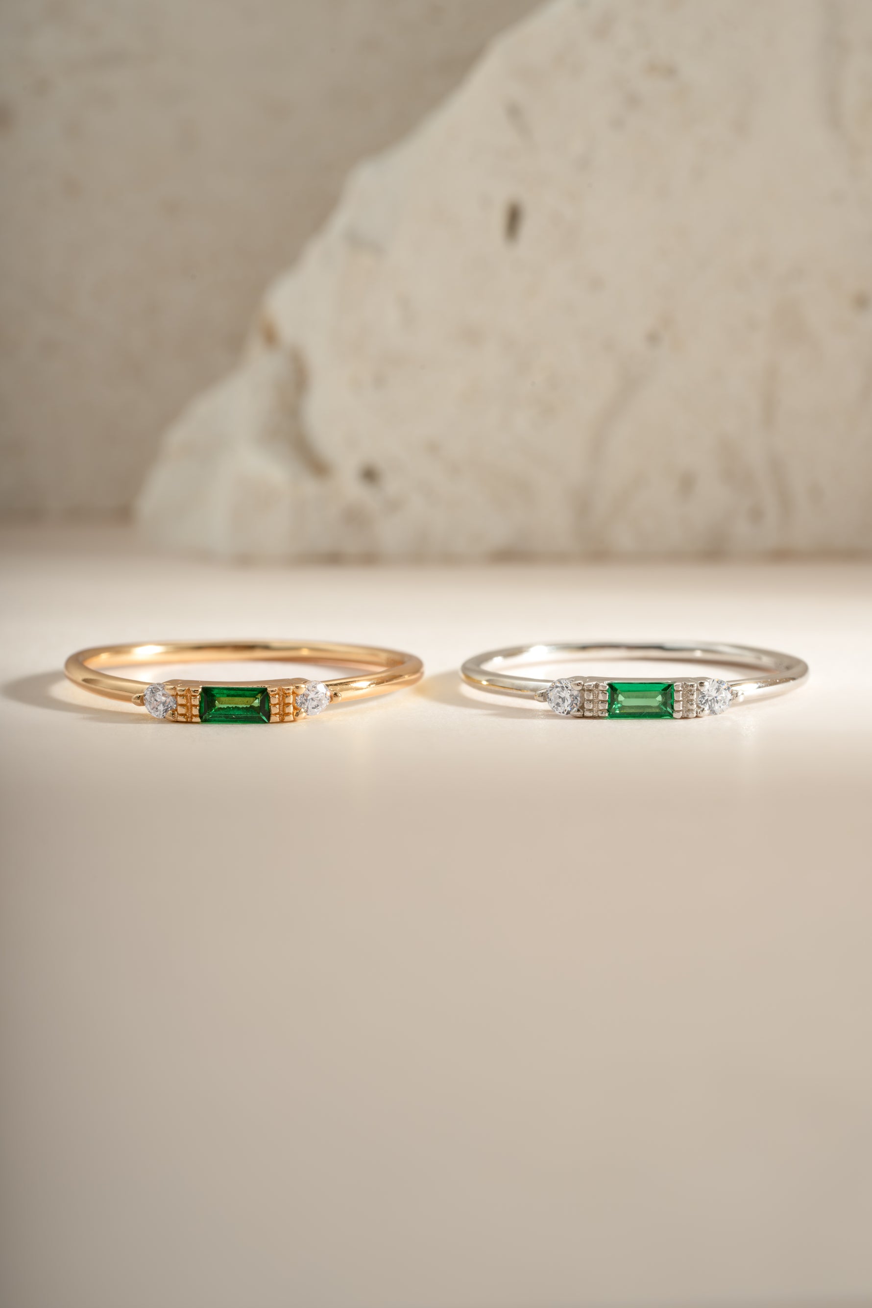 Sterling silver and gold Emerald Baguette Ring featuring a vibrant emerald gemstone set in an elegant ring design.