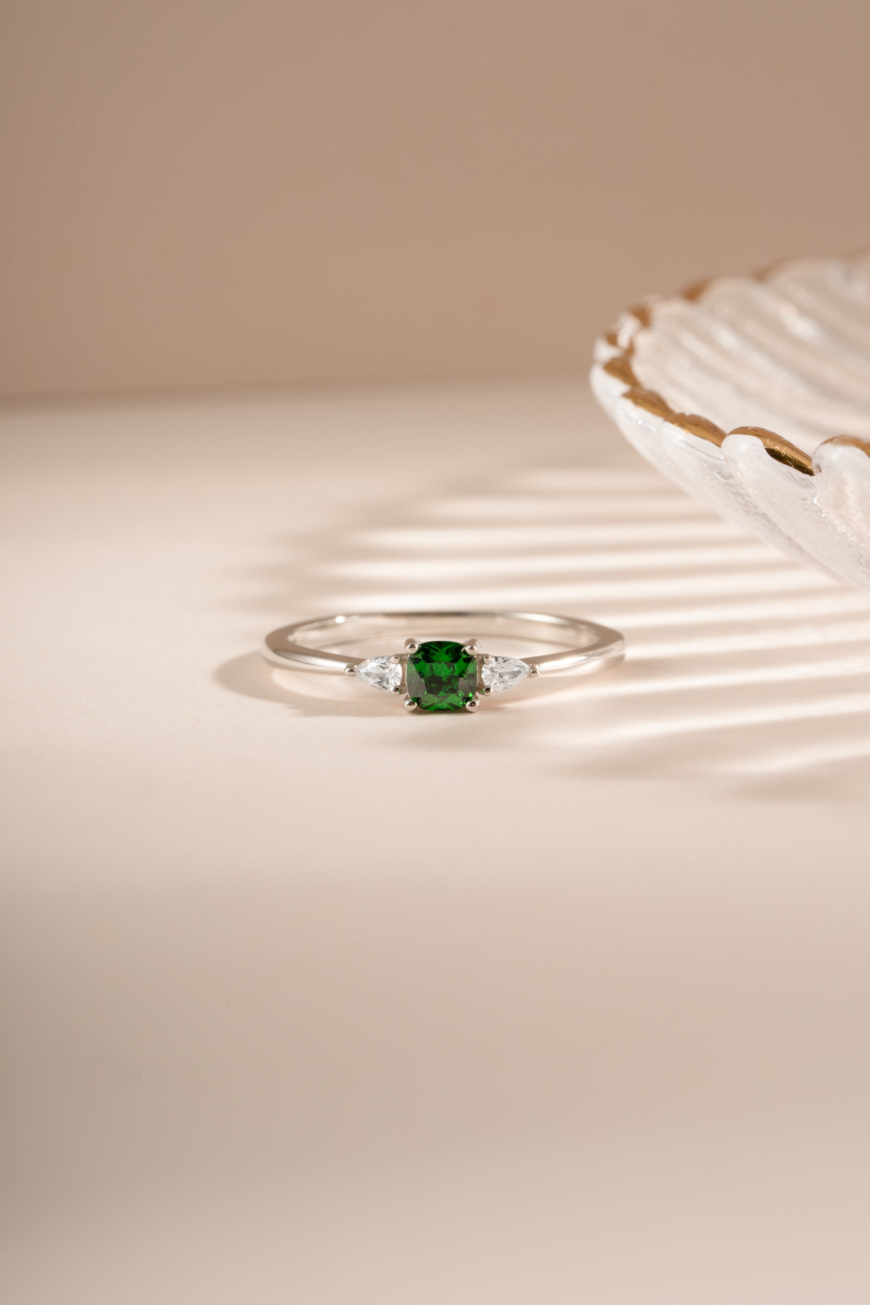 Sami Jewels emerald cushion ring featuring a sparkling green emerald gemstone set in sterling silver.