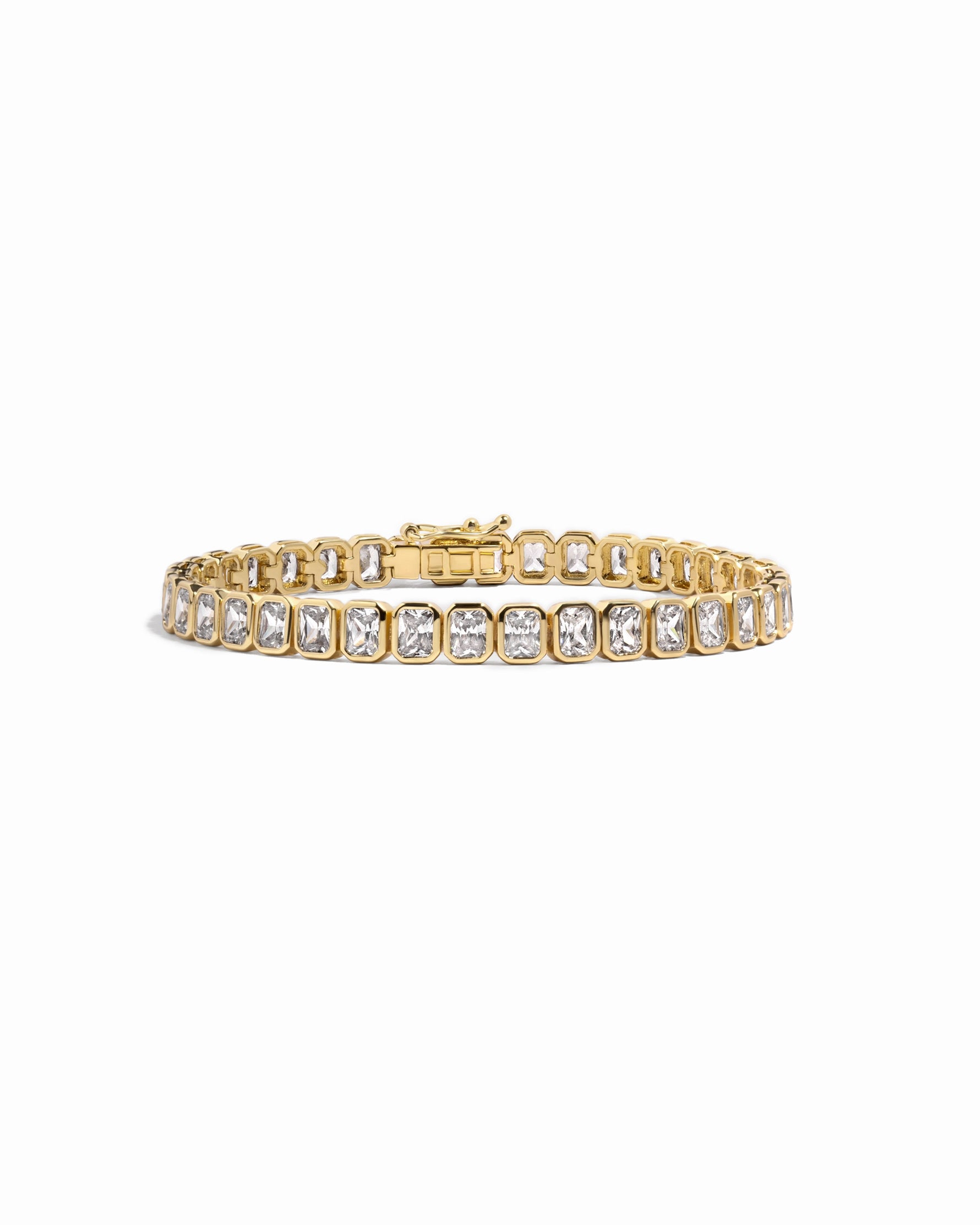 Gold emerald-cut bezel tennis bracelet by Sami Jewels displayed on a white background with detailed close-up of the bracelet design.