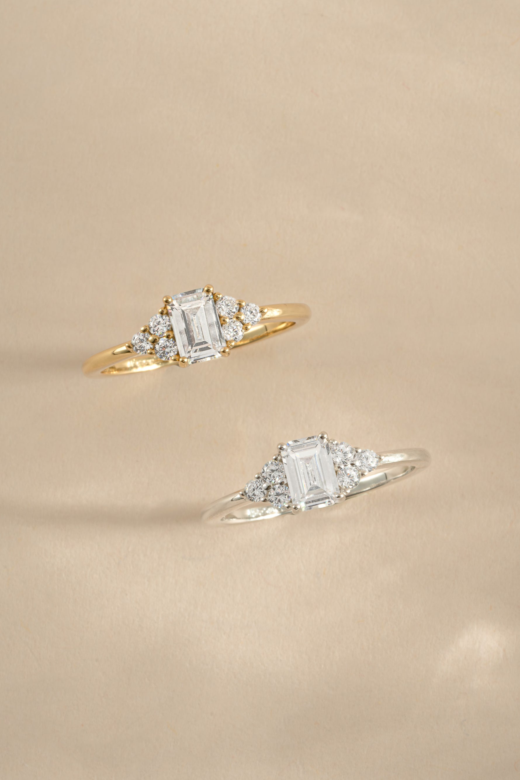 Emerald cut diamond stacking ring by Sami Jewels featuring gold and sterling silver band with a sparkling emerald-cut gemstone.