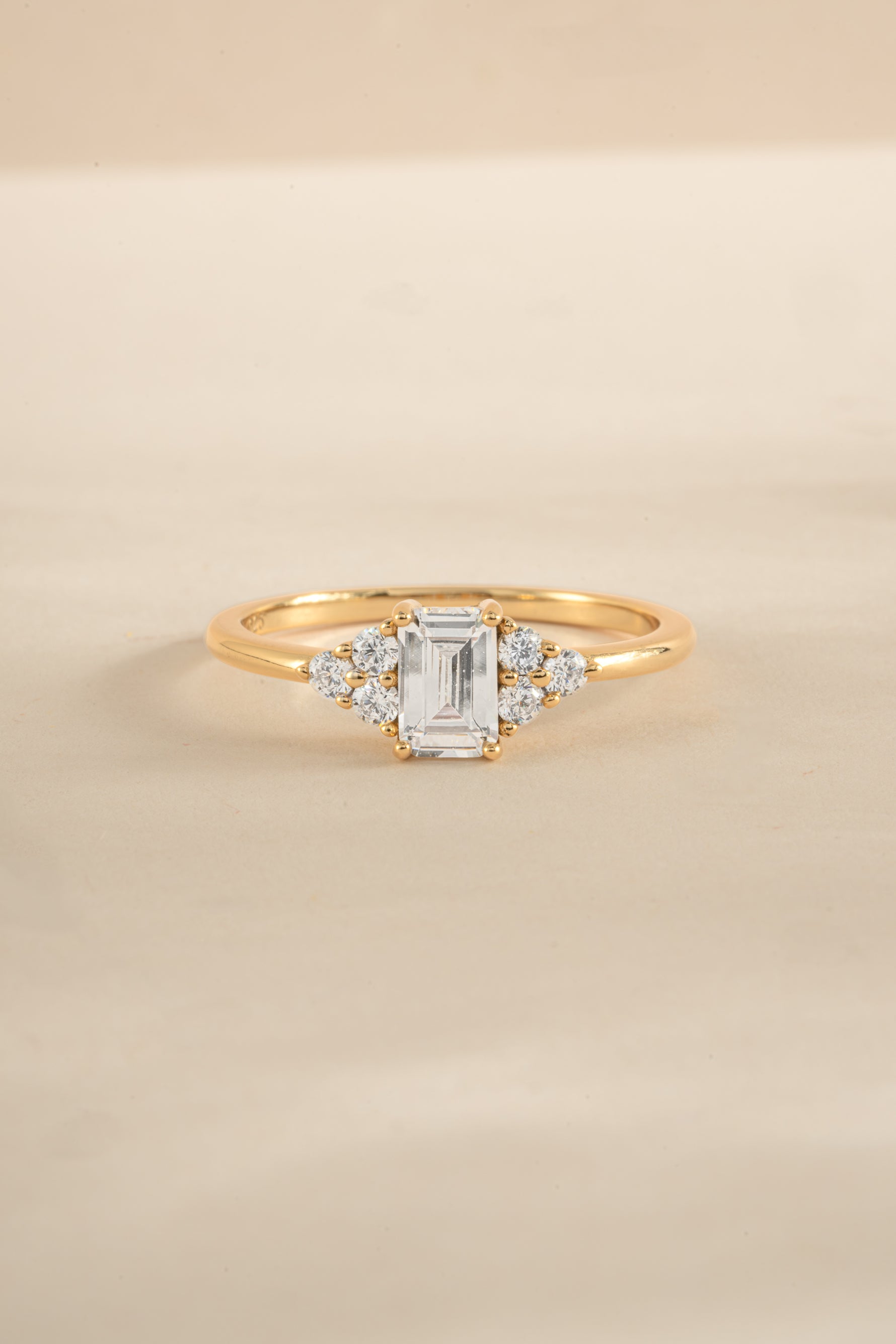 Elegant gold stacking ring with emerald-cut diamond, crafted by Sami Jewels, showcasing a sleek and sophisticated jewelry design.