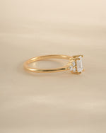 Gold emerald cut diamond stacking ring by Sami Jewels, side view showcasing the elegant gemstone and sleek band design.