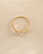 Gold Sami Jewels emerald cut diamond stacking ring viewed from the top, showcasing its elegant rectangular gemstone.