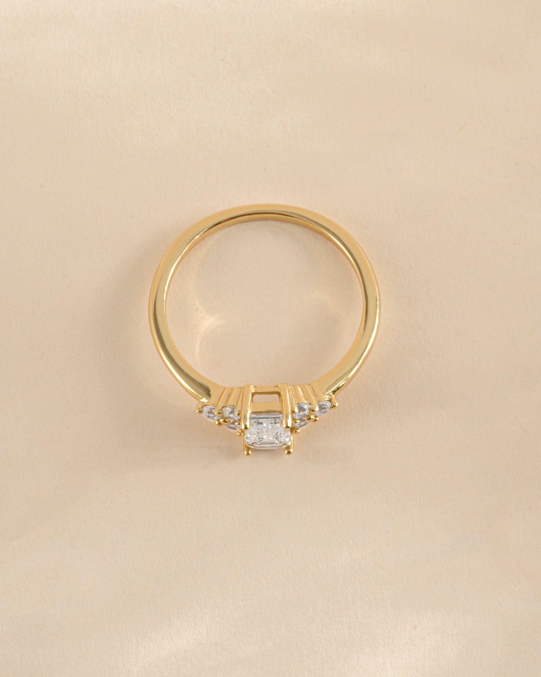 Gold Sami Jewels emerald cut diamond stacking ring viewed from the top, showcasing its elegant rectangular gemstone.