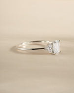 Sterling silver emerald cut diamond stacking ring by Sami Jewels, side view showing sleek design and sparkling gemstone.