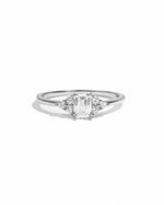 Sterling silver Sami Jewels emerald cut stacking ring with a central diamond-shaped gemstone on a white background.