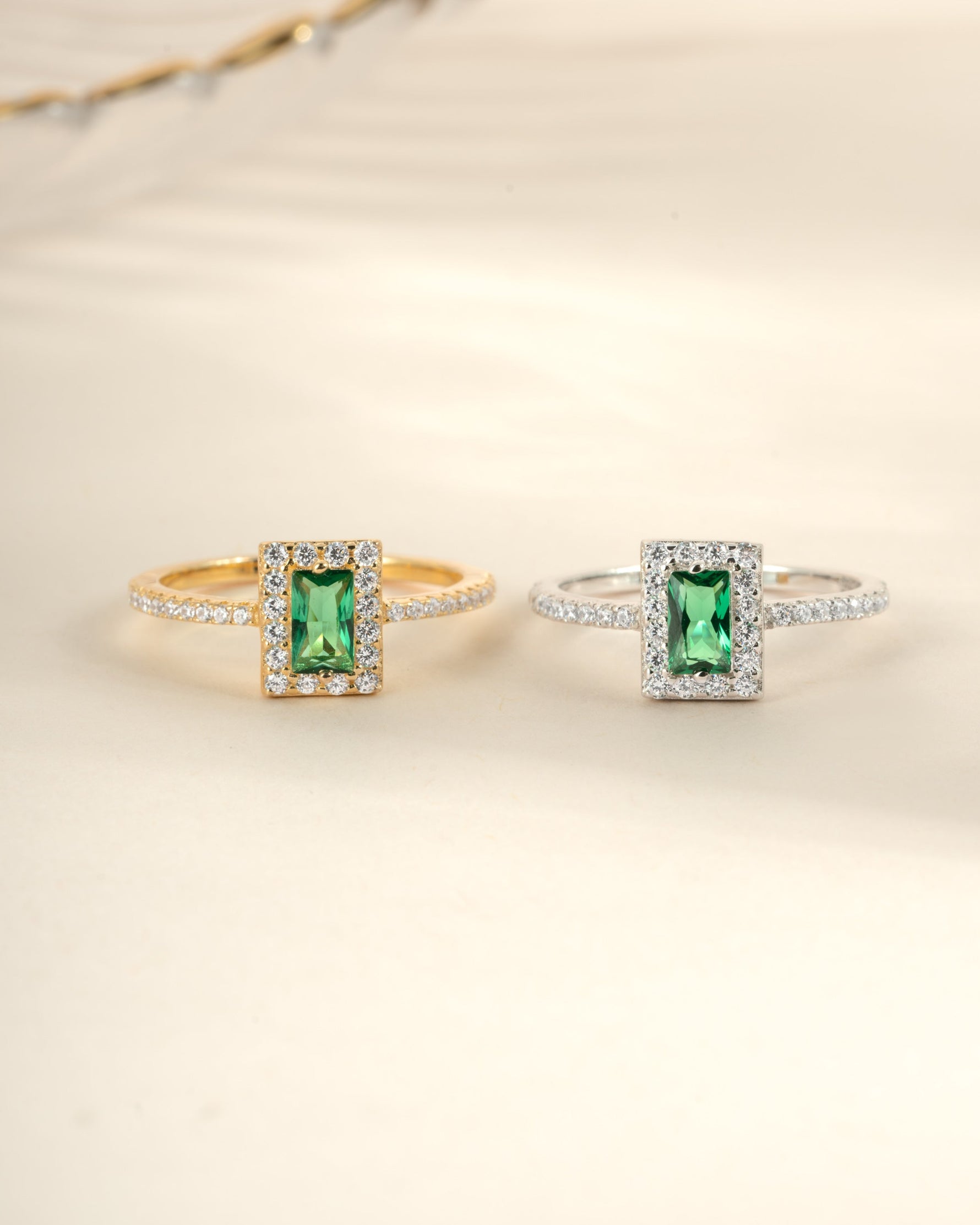 Sami Jewels Emerald CZ ring with emerald-cut green gemstone set in sterling silver and gold accents.