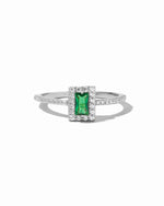 Sterling silver emerald-cut CZ ring by Sami Jewels, featuring a vibrant green gemstone on a white background.