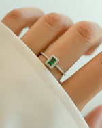 Emerald-cut Sterling Silver Ring with emerald CZ stone, stylish jewelry piece from Sami Jewels on a model.