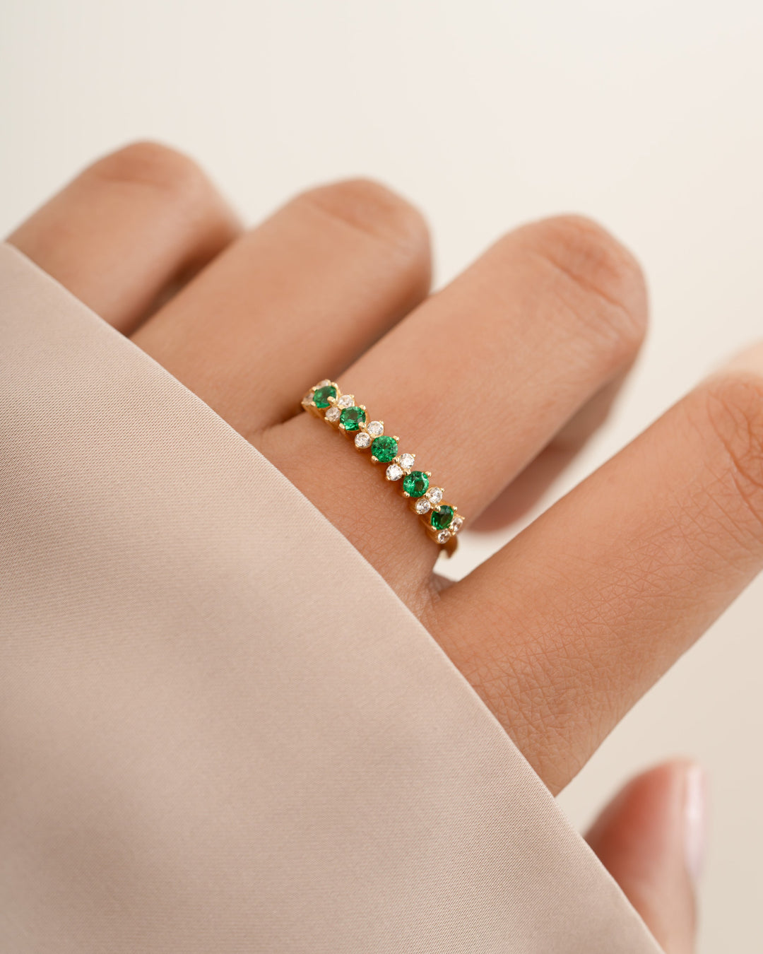 Gold Emerald Stephanie Stacking Ring by Sami Jewels featuring vibrant emerald cubic zirconia stones on a sleek band.