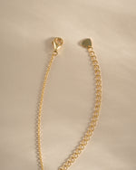 Gold Emerald Flower Necklace by SJ Faire featuring a charming emerald flower pendant and a lobster clasp closure.