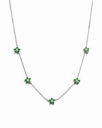 Sterling silver Emerald Flower Necklace with a detailed flower charm, showcasing elegant jewelry design against a white background.