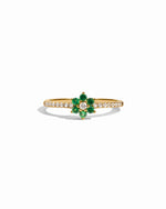 Gold Emerald Flower Ring by Sami Jewels featuring a detailed green emerald flower design on a white background.