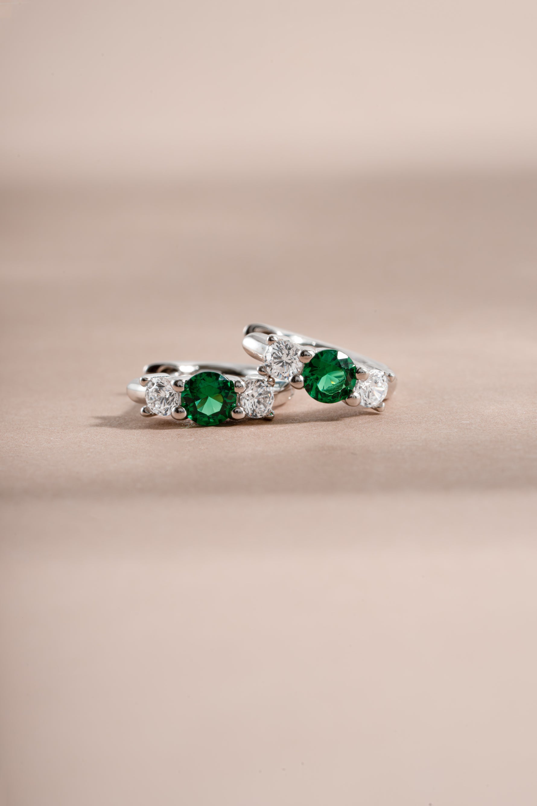 emerald three stone huggie hoop earring in sterling silver 