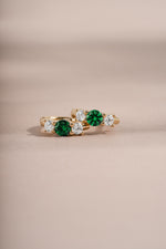 emerald three stone huggie hoop earring in gold closeuo
