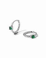emerald spiral huggies in sterling silver on white background
