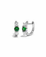 emerald three stone huggie hoop earring in sterling silver white background 