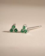 Sterling silver tiny emerald 3-stone stud earrings by Sami Jewels featuring vibrant green emeralds and a sleek, minimalist design.