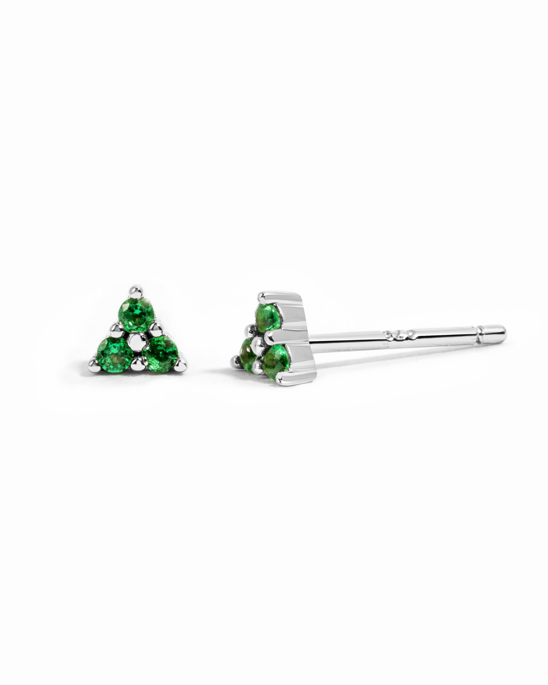 Sterling silver Tiny Emerald 3 Stone Stud Earrings by Sami Jewels with three vibrant emerald stones on a white background.