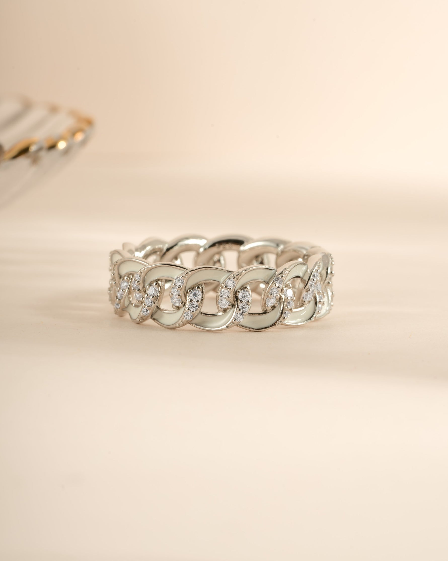 White enamel chain ring by Sami Jewels featuring sterling silver with a detailed front view of the ring.