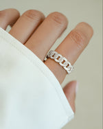 White enamel chain ring from Sami Jewels, sterling silver jewelry featuring a stylish enamel design on a chain ring.