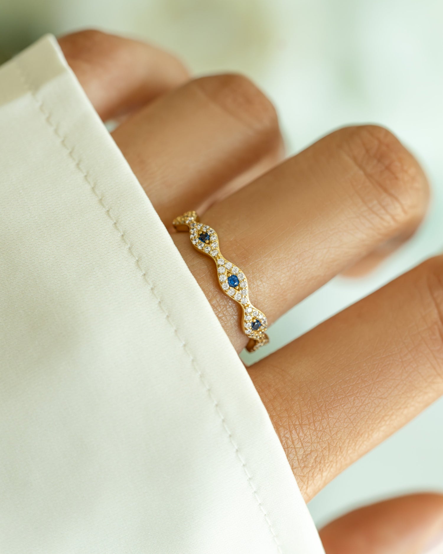 Gold Evil Eye Band ring by Sami Jewels featuring a detailed evil eye design on a sleek gold band.