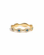 Gold evil eye ring from Sami Jewels featuring a protective eye design on a white background.