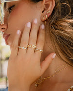 Gold Evil Eye Band Ring by Sami Jewels featuring a protective eye design on a sleek, elegant ring model.