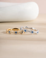 Sterling silver and gold Evil Eye ring from Sami Jewels, featuring protective eye design on a sleek band.