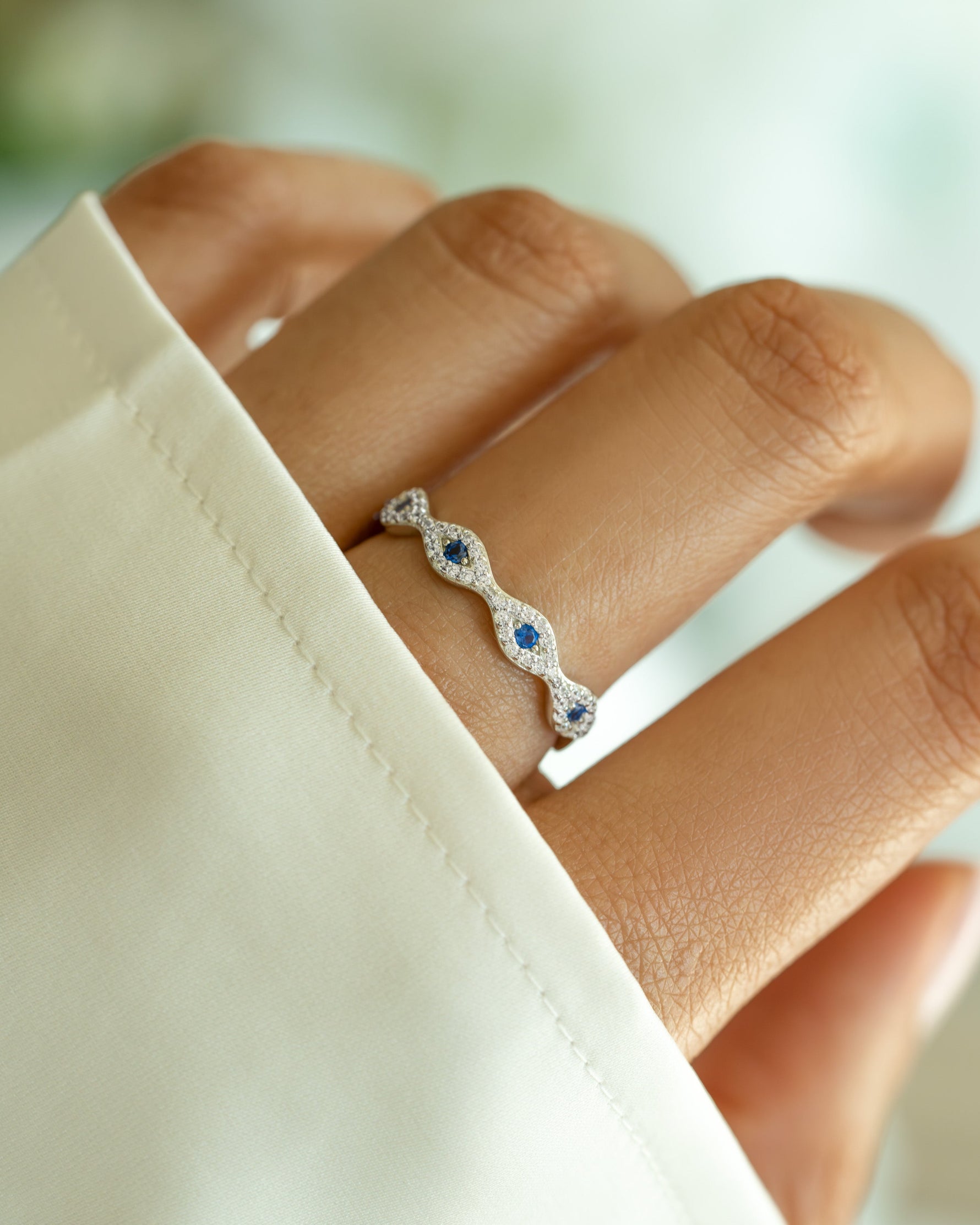 Sterling silver Evil Eye band ring by Sami Jewels featuring a detailed evil eye design on a sleek ring.