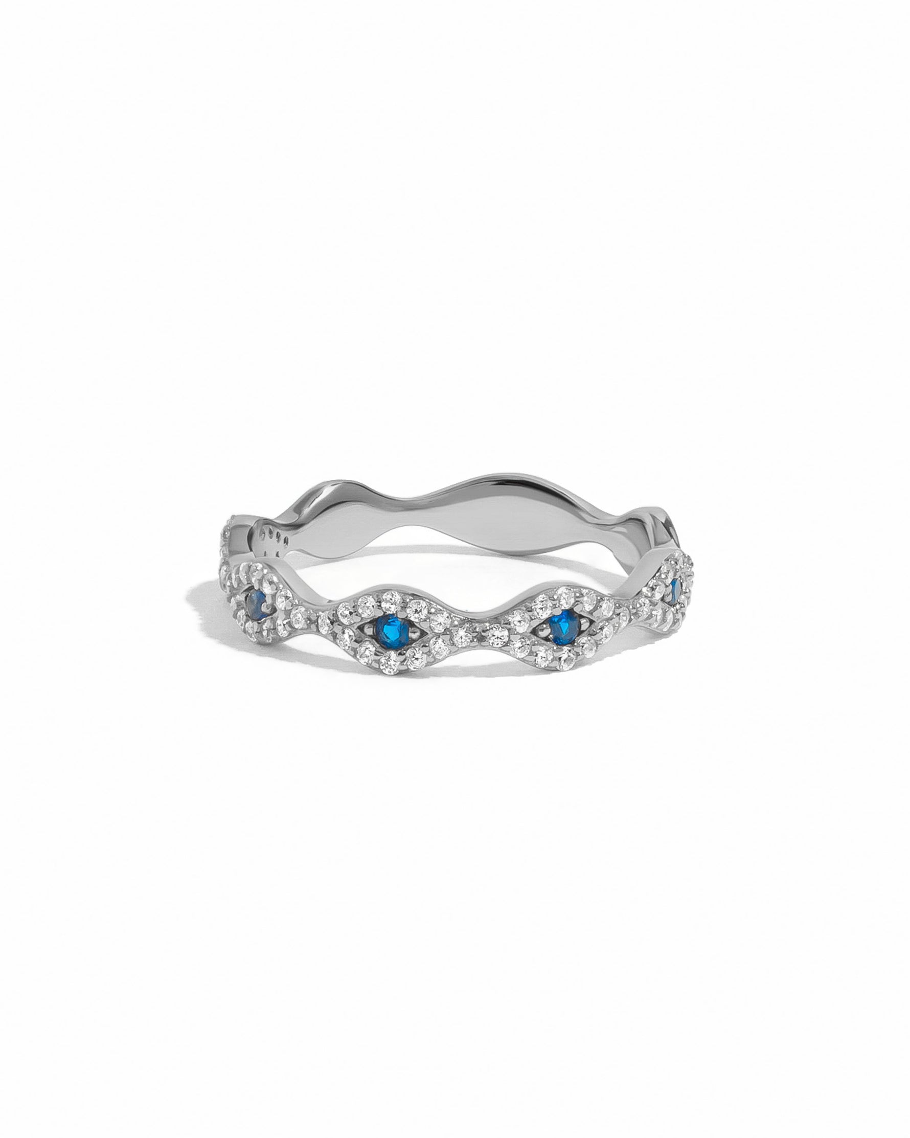 Sterling silver evil eye ring from Sami Jewels featuring a detailed blue and white eye design on a plain white background.