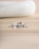 Sterling silver Evil Eye Ring by Sami Jewels featuring a detailed eye design on a sleek band.