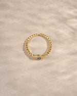 adjustable evil eye ring in gold top view showcasing adjustable fit