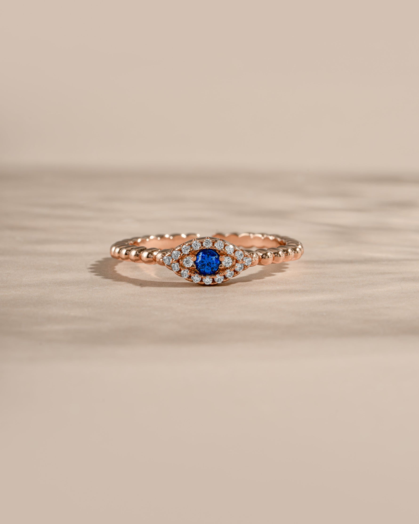 adjustable evil eye ring in rose gold front view