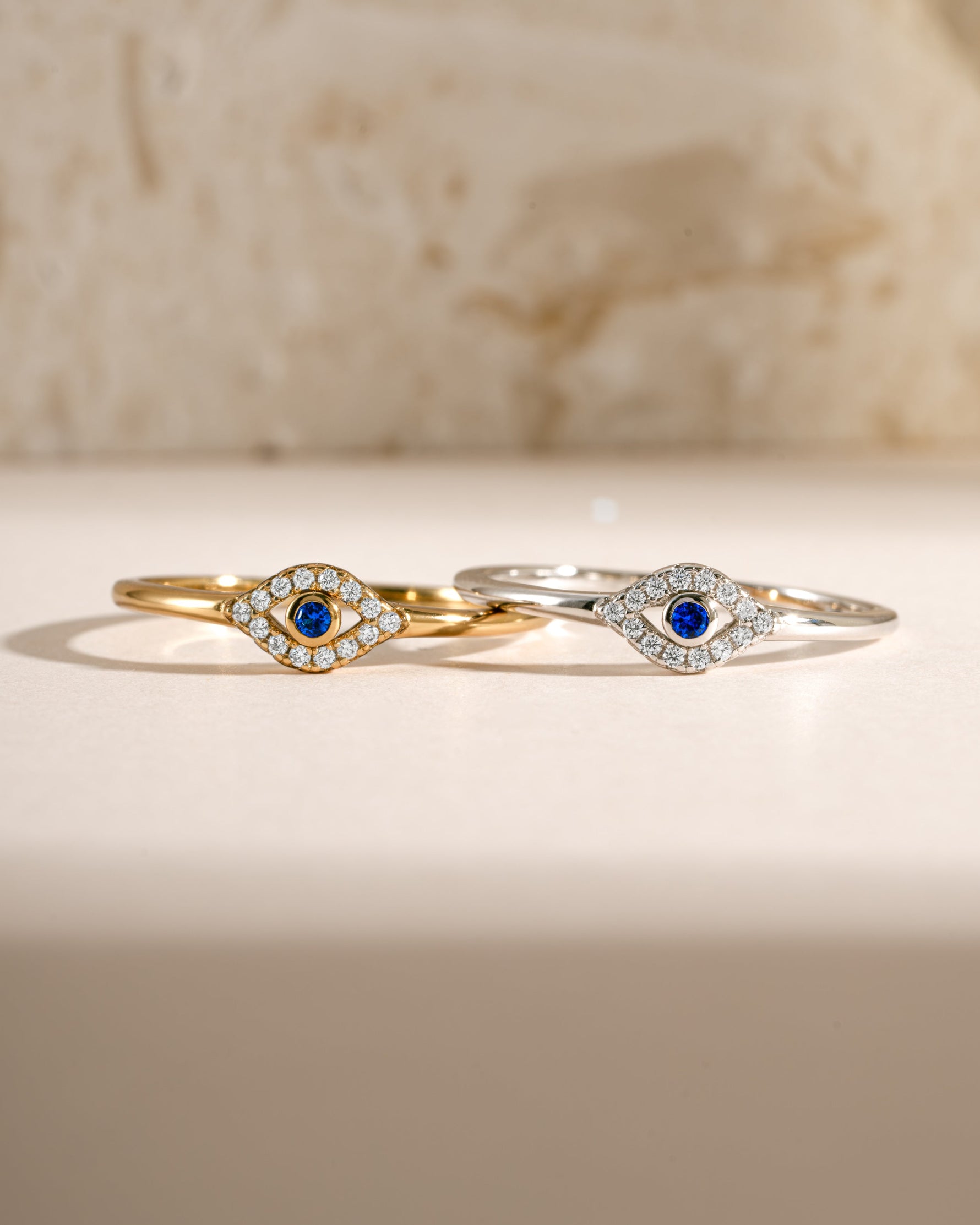 Tiny blue evil eye ring by Samijewels-527 featuring gold and sterling silver, with a detailed blue eye design on the ring.