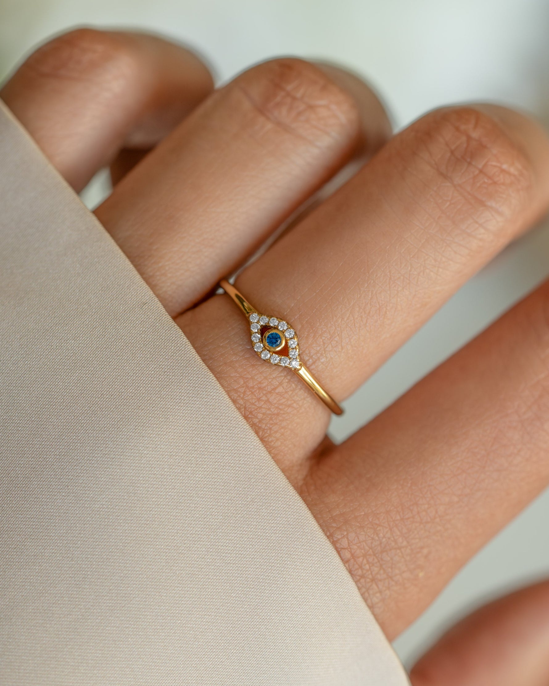 Tiny blue evil eye ring by Samijewels-527 featuring a gold band and detailed evil eye design, perfect for everyday jewelry.