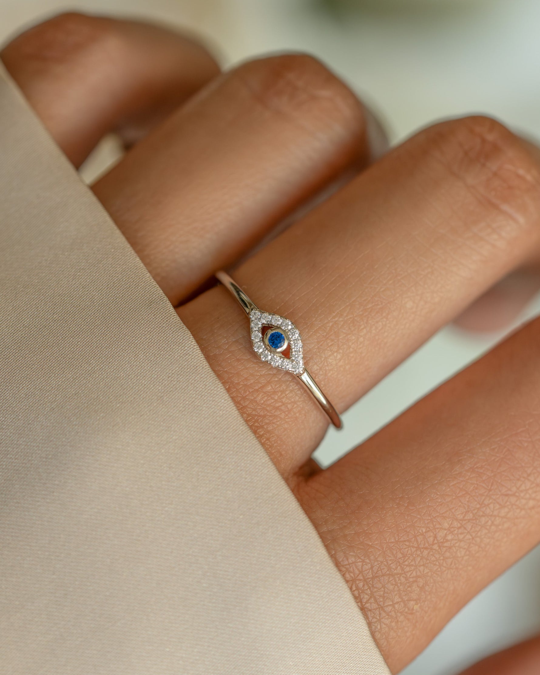 Sterling silver Tiny Blue Evil Eye Ring by Samijewels-527, showcasing a delicate evil eye design on a ring.