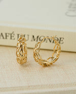 Gold filigree tapered hoop earrings by Sami Jewels, side view showing intricate metalwork and elegant design.