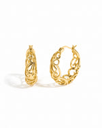 Gold filigree tapered hoop earrings by Sami Jewels with intricate detailed design on a white background.