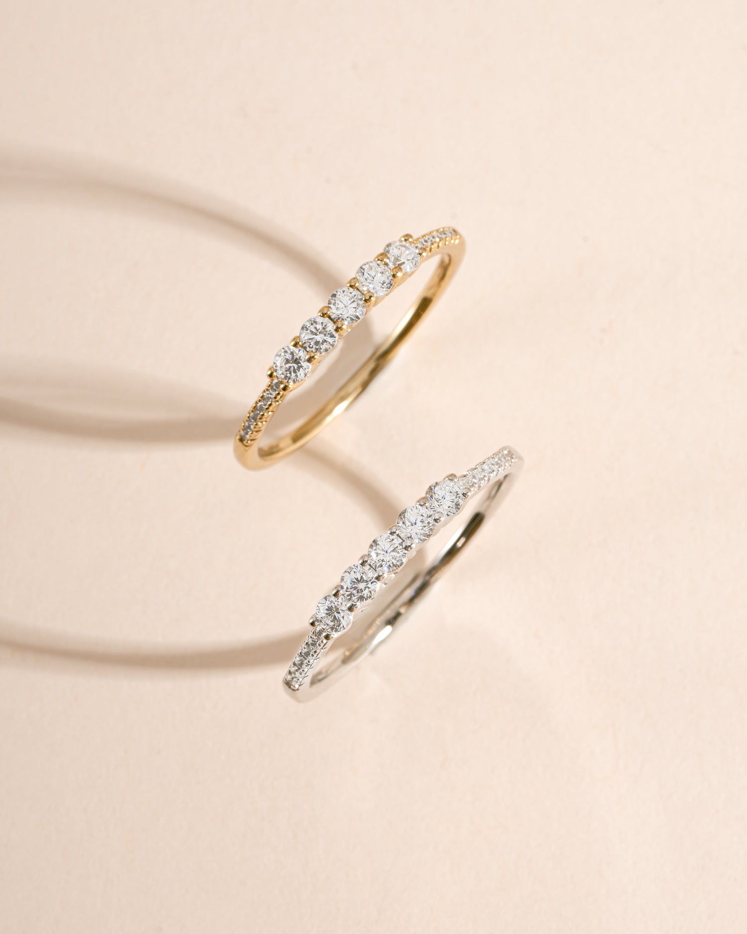 Samijewels-527 5 Stone CZ ring featuring gold and sterling silver, showcasing a top view of the elegant stacking design with sparkling stones.