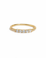 five stone cubic zirconia stacking ring in gold on model on a white background 