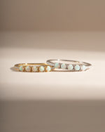 Sami Jewels five-stone opal ring featuring gold and sterling silver band with vibrant, colorful opal stones.